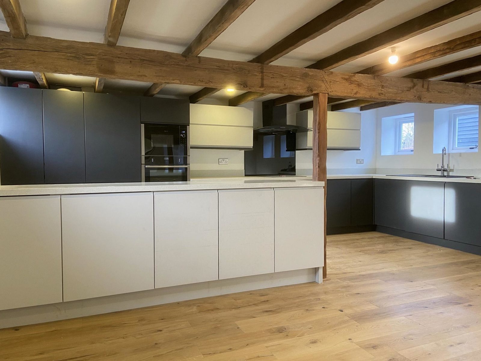 Two tone handleless kitchen installation - White and indigo handleless kitchen with contemporary style