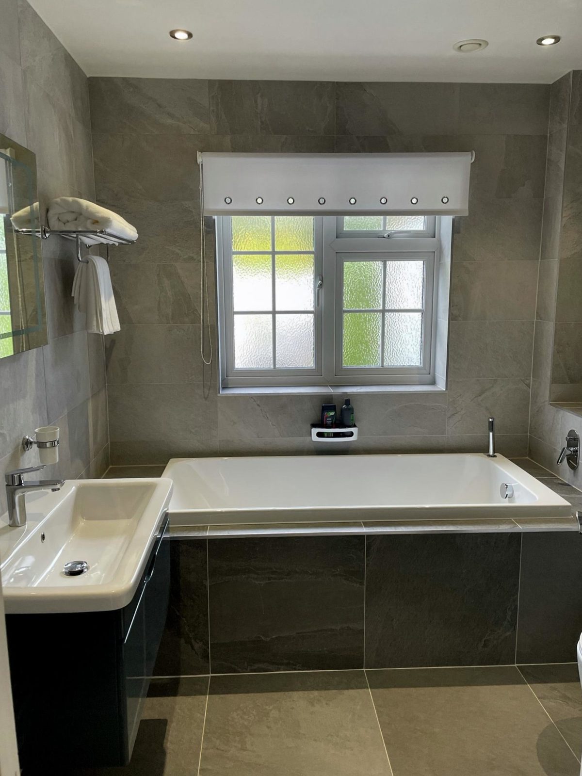 Luxury bathroom installation Essex - Modern bathroom renovation with premium fixtures and elegant tiling