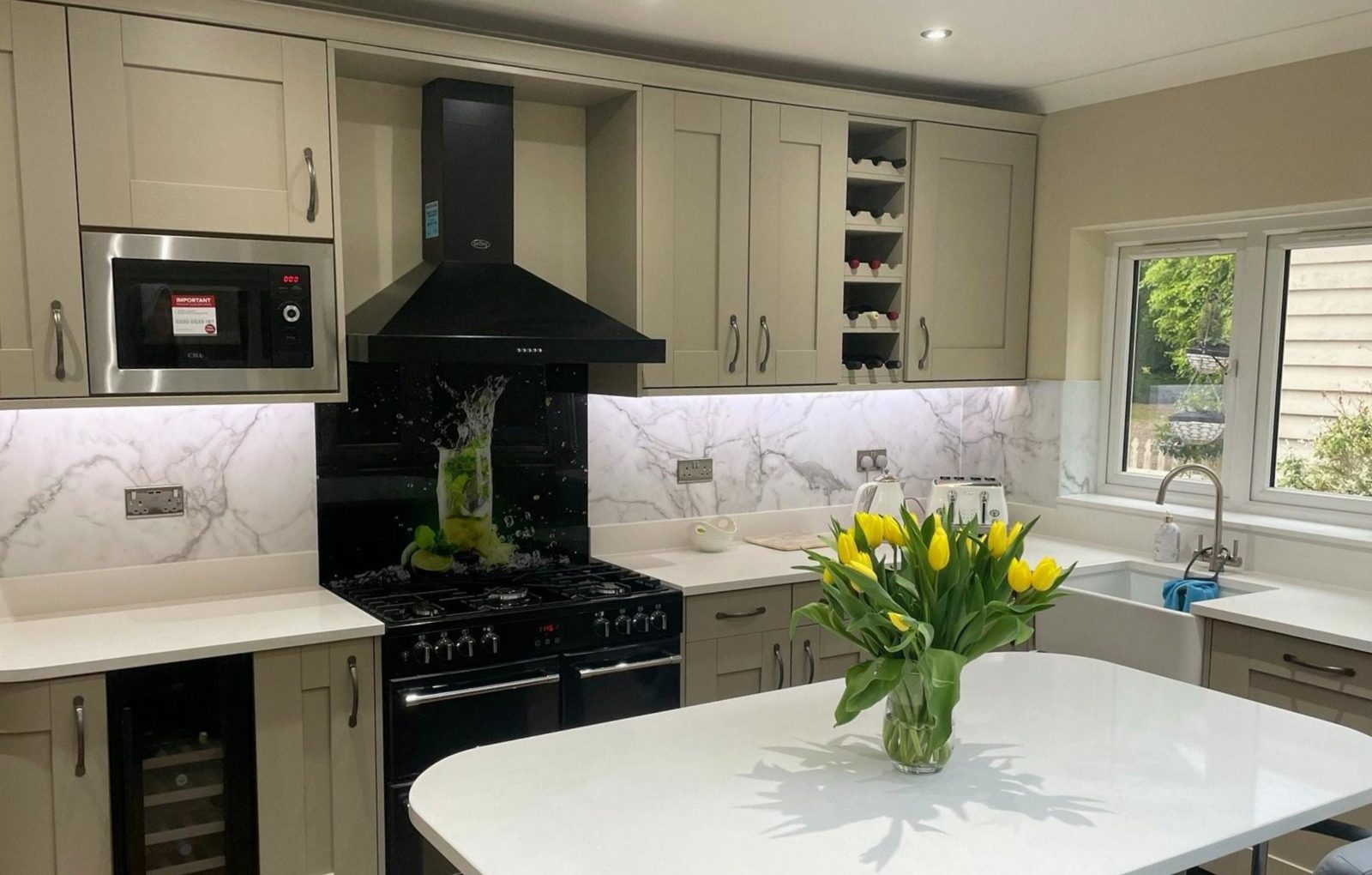 Olive shaker kitchen installation Hertfordshire - Khaki green shaker kitchen with black range cooker